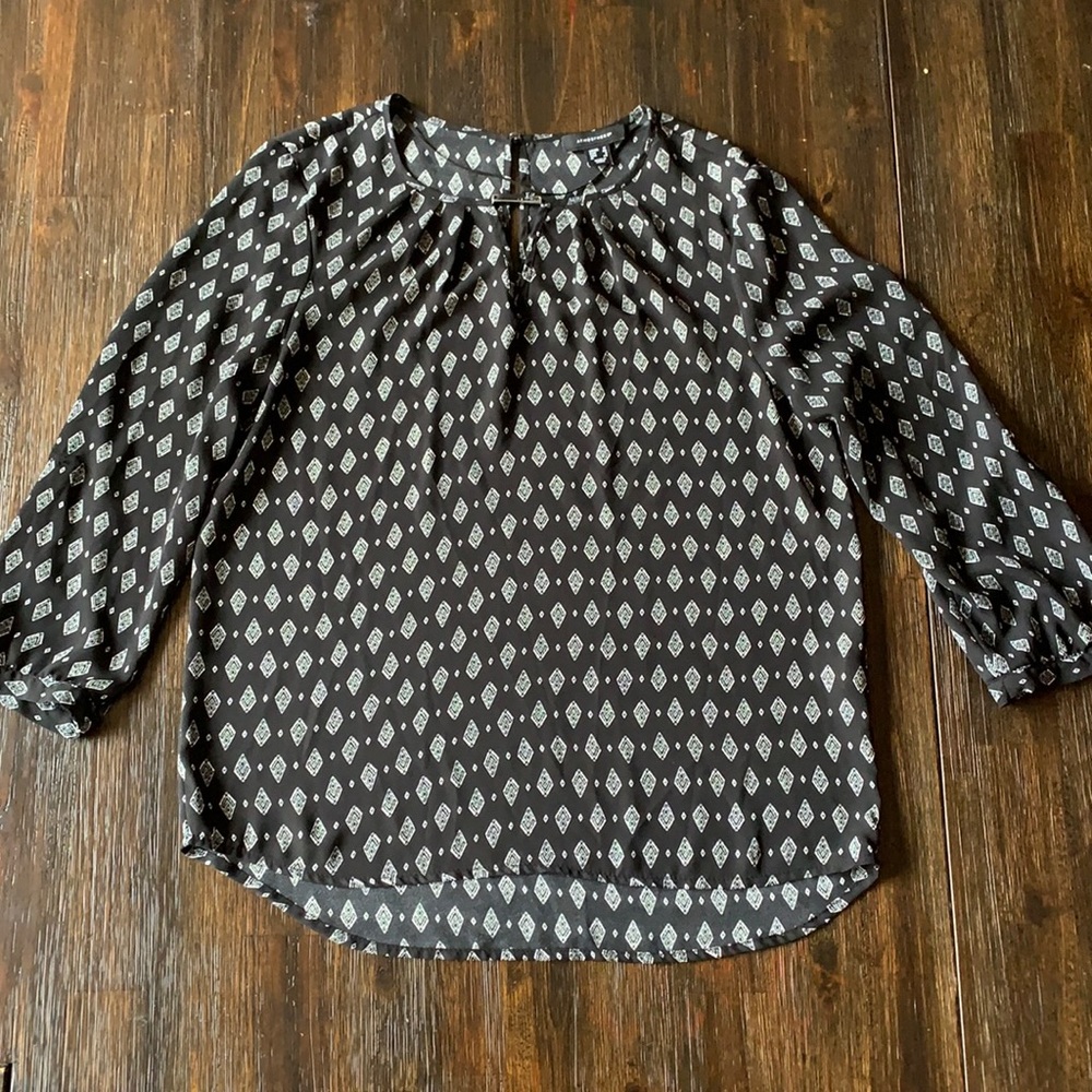 Medium black blouse, sheer.